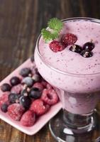 Smoothies of frozen raspberries and black currant   . photo