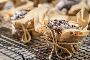 Vanilla muffins with powder sugar on colling rack