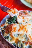 Baked spinach with cheese and ham