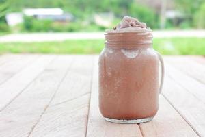 chocolate smoothie on a wooden table photo