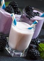 Milkshake with wild blueberries and blackberries photo