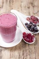 Smoothies of black currant, red currant and gooseberry with yogurt. photo