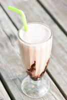 Protein snack. Ice-cream milkshake with chocolate. Outdoors closeup. photo
