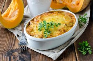 Gratin of pumpkin pasta and minced meat photo