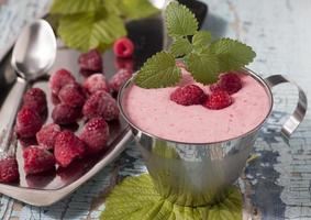 Cocktail of frozen raspberries with yogurt in a metal cup. photo