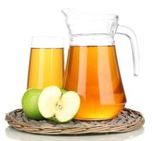 Full glass and jug of apple juice isolted on white photo
