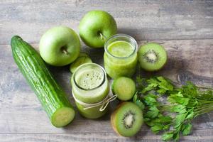 Green smoothie with cucumber, kiwi and apples photo