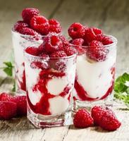 Raspberry ice cream with berries and mint photo