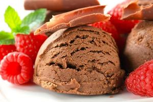 Chocolate ice cream with fresh raspberries photo
