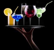 different alcohol drinks set on a tray photo