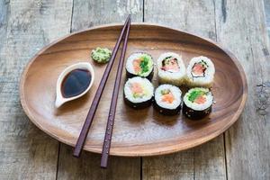 Sushi on a wooden plate photo