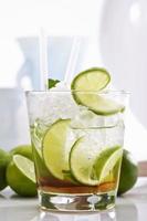 Caipirinha with ice and lime in a glass