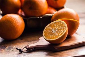 Fresh oranges. Cut oranges. Pressed orange manual method. photo