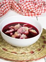 red borscht with dumplings - traditional Polish dish photo