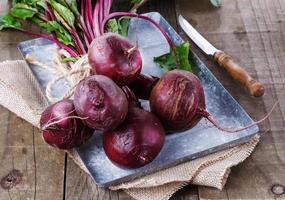 Organic beetroot over rustic wooden background