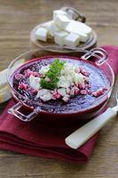 vegetable cream soup of beetroot with soft goat cheese