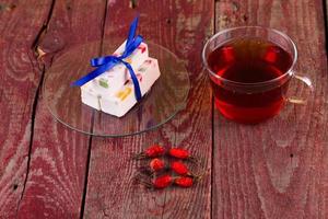 Tea and fruit candy on a table photo