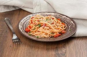 plate of spaghetti and tomato sauce photo