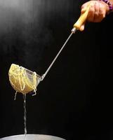 Cooking egg or yellow noodle in hot water