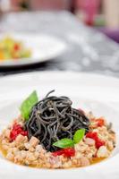 Black squid ink pasta with seafood photo
