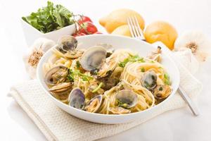 Pasta with Clams on white background photo