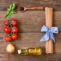 Ingridients for pasta with tomato sauce photo