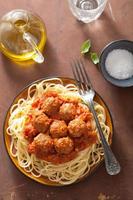 spaghetti with meatballs in tomato sauce photo