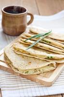 Flatbread with mashed potato and spring onion photo