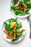 Grilled fish with arugula salad photo