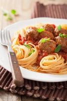 spaghetti with meatballs in tomato sauce photo