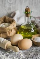 flour, olive oil, eggs - the ingredients to prepare pasta photo