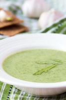 Green garlic cream soup with leaves rukola, arugula, diet photo