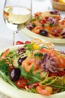 Seafood spaghetti pasta dish with octopus and shrimps photo