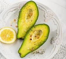 avocado halves with butter salt and pepper