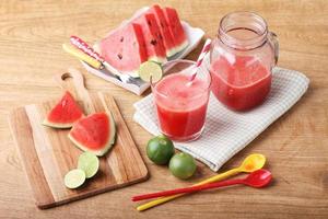 Healthy watermelon lime smoothie and fresh watermelon photo
