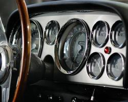 sports car speedometer macro older gauges dash board photo