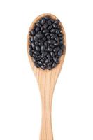 Black  beans on wooden spoon photo