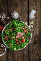 Fresh salad with bacon and croutons photo