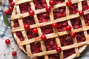cherry pie and ripe berries close-up horizontal top view