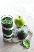 Healthy smoothie. Avocado, parsley, apple, spinach. photo