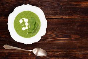 Spinach soup background with copy space. photo