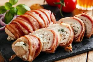 chicken breast stuffed  feta cheese and herbs wrapped in bacon photo