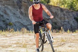 athlete man cycling on a bicycle photo