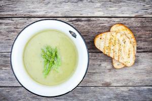 homemade cream soup with asparagus and toasted ciabatta