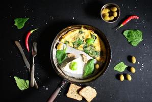 Fresh white cheese with scrambled eggs and spinach photo