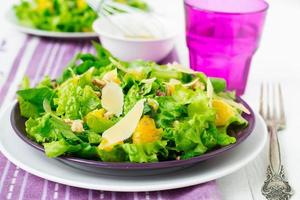 salad with spinach, oranges and nuts photo