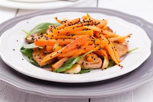 Tofu salad with carrots, spinach and sesame photo