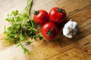 tomatoes garlic and parsley photo