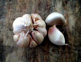garlic on brown wooden background