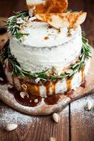 Decorated rosemary on cream cake photo